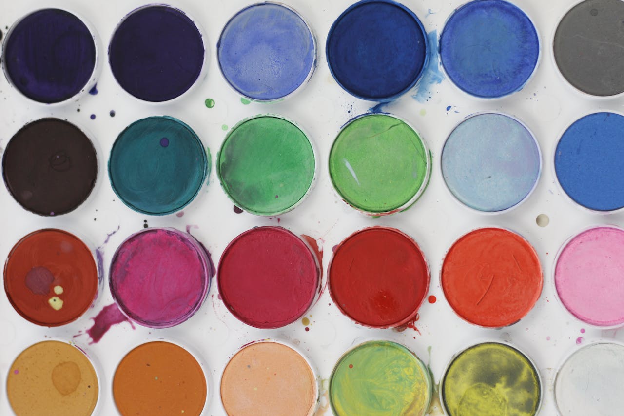 A colorful close-up of vibrant watercolor paint palette ideal for art projects.